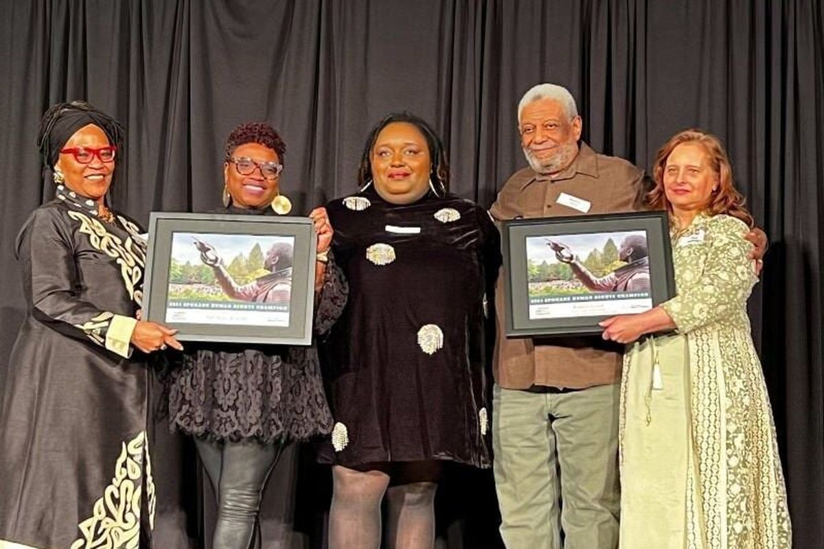 Black Lens editor April Eberhardt, second from left, and Black Lens contributor Bob Lloyd, second from right, are honored as the 2024 Spokane Human Rights Champion Awardees.   (April Eberhardt/The Black Lens)