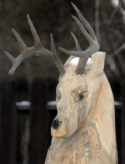 
A reindeer totem pole was carved from an old big yellow pine in the Wolfrums' backyard. 
 (Photos by J. Bart Rayniak / The Spokesman-Review)