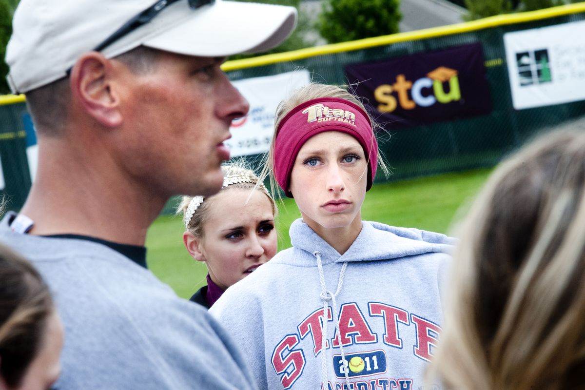 University senior shortstop Karly Schuh listens to her father and coach, Jon Schuh, give pointers during practice Wednesday. (Tyler Tjomsland)