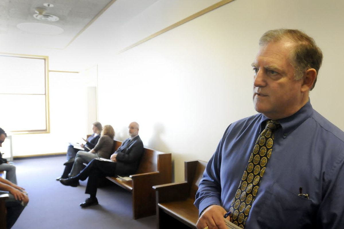 Gary Berg, the chief deputy of the Spokane County Clerk’s Office, stands in the hallway where collection clerks meet with people who have financial commitments to be paid from criminal court judgments, such as restitution or court costs. When defendants do not pay their legal financial obligations, the clerk