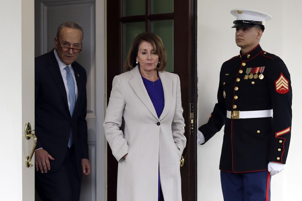 Senate Minority Leader Chuck Schumer of N.Y., and Speaker of the House Nancy Pelosi of Calif., walk from the West Wing to speak to reporters after meeting with President Donald Trump about border security in the Situation Room of the White House, Friday, Jan. 4, 2018, in Washington. (Evan Vucci / Associated Press)