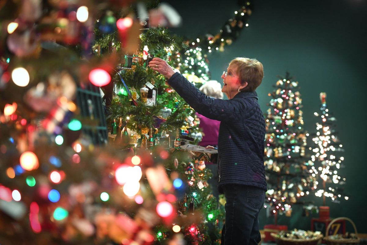 Lois Morrison, of Spokane, delights on viewing a glass ornament at the Old World Christmas outlet while gift shopping for her grandchildren Dec. 11 in Spokane. (Dan Pelle / The Spokesman-Review)