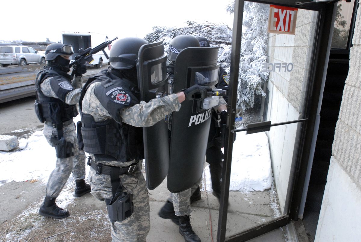 Members of the Special Response Team  get ready to enter a building during a training exercise. (J. Rayniak / The Spokesman-Review)