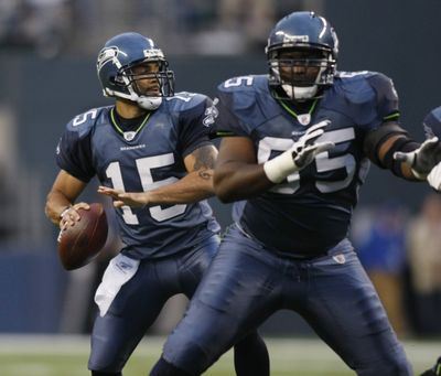 Center Chris Spencer, right, is returning to form, but the Seahawks’ offensive line still isn’t intact.  (Associated Press / The Spokesman-Review)