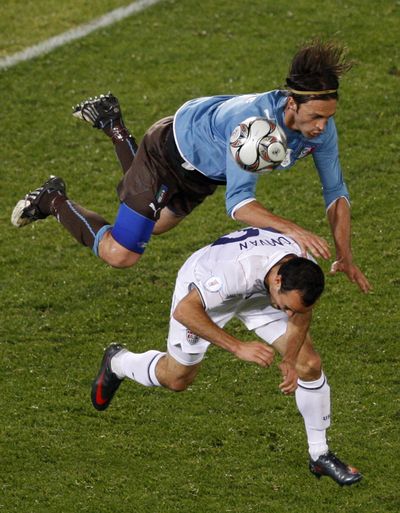 Italy’s Nicola Legrottaglie jumps over USA’s Landon Donovan during their Confederations Cup soccer match in  South Africa. (Associated Press / The Spokesman-Review)