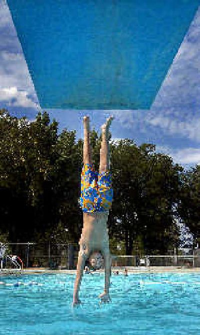 
The days of diving are drawing to a close, and thoughts of winterizing the pool are near.
 (File/Associated Press / The Spokesman-Review)