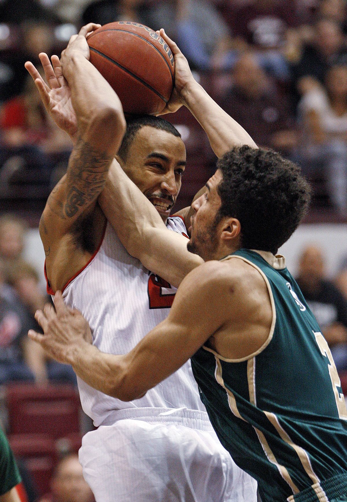 Eastern Washington guard Drew Brandon, left, fends off Sacramento State guard Cody Demps. (Associated Press)