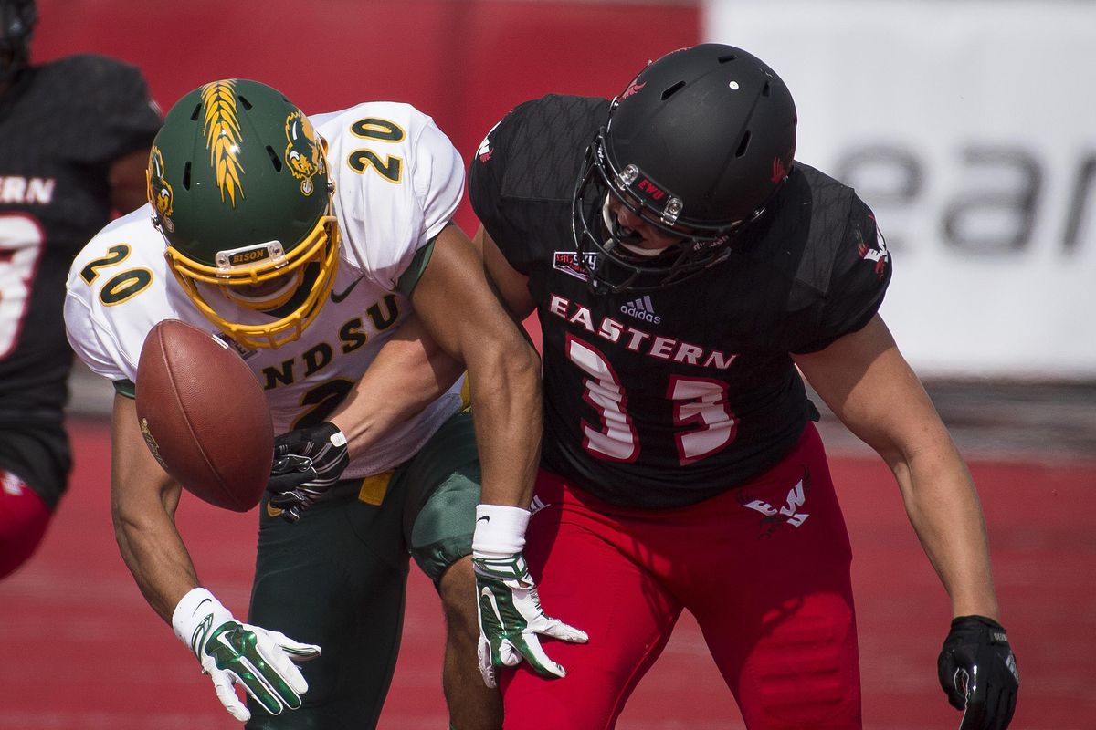 Eastern Washington defensive back Cole Karstetter  forces an incomplete pass by knocking the ball away from North Dakota State wide receiver Darrius Shepherd  during the first half Sept. 9, 2017, in Cheney. (Colin Mulvany / The Spokesman-Review)