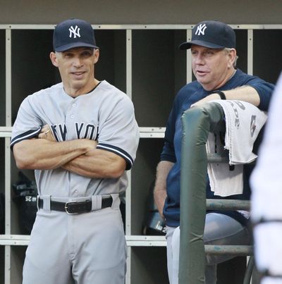 Yankees owner Hal Steinbrenner says manager Joe Girardi, left, and his coaching staff is not to be blamed for New York’s slow start. (Nam Y. Huh / Associated Press)