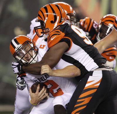 Cleveland Browns quarterback Johnny Manziel is sacked by Cincinnati Bengals defensive tackle Geno Atkins. (Frank Victores / AP)