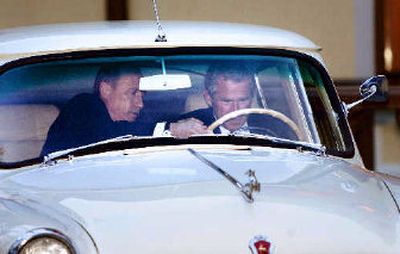 
President Bush received some tips from Vladimir Putin on driving the Russian leader's prized 1956 Volga during Bush's visit to Moscow last May. 
 (Associated Press / The Spokesman-Review)