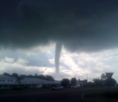 A funnel cloud is shown in this Aug. 18, 2011 photo made in Wilmington, N.C. The National Weather Service issued a tornado warning for Southern New Hanover County until 11 a.m. The Weather Service also confirmed that there are numerous water spouts off the coast of Southeastern North Carolina. The Carolina Beach Police Department has reported that two water spouts came in and touched the ground in the Alabama Avenue vicinity. (Shannan Bowen / Wilmington Star-news)
