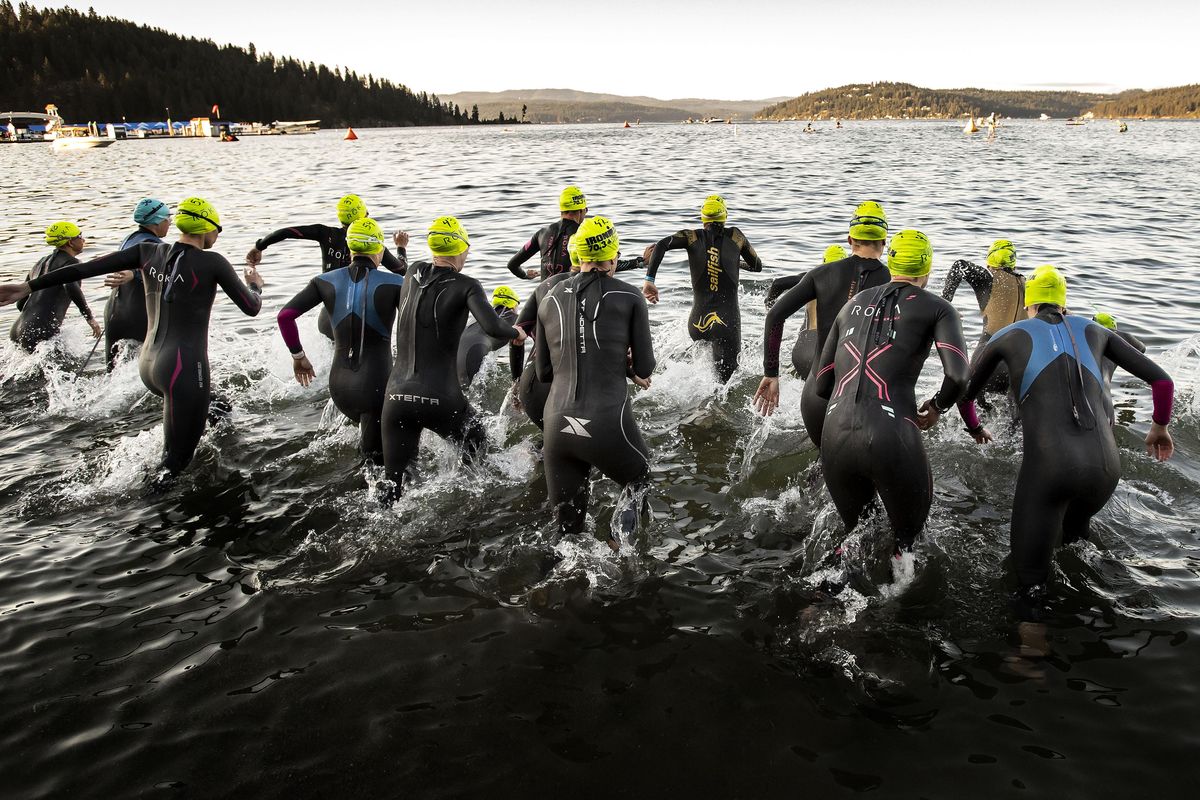 The Women’s Pro Division start their swim in Lake Coeur d’Alene during the Coeur d’Alene IRONMAN 70.3 triathlon, , June 24, 2018. Over 1900 athletes from around the country participated in half Ironman, which included swim, bike and run events. (Colin Mulvany / The Spokesman-Review)
