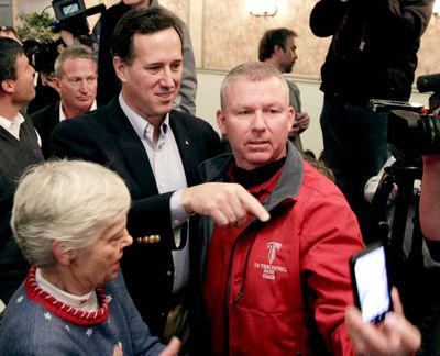 Republican presidential candidate Rick Santorum greets supporters after a campaign stop in Colorado Springs, Colo., on Tuesday. (Associated Press)