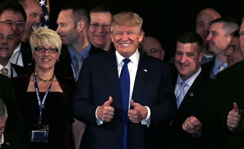 Republican presidential candidate, Donald Trump flashes thumbs up after being endorsed at a regional police union meeting in Portsmouth, N.H., Thursday. (AP Photo/Charles Krupa)