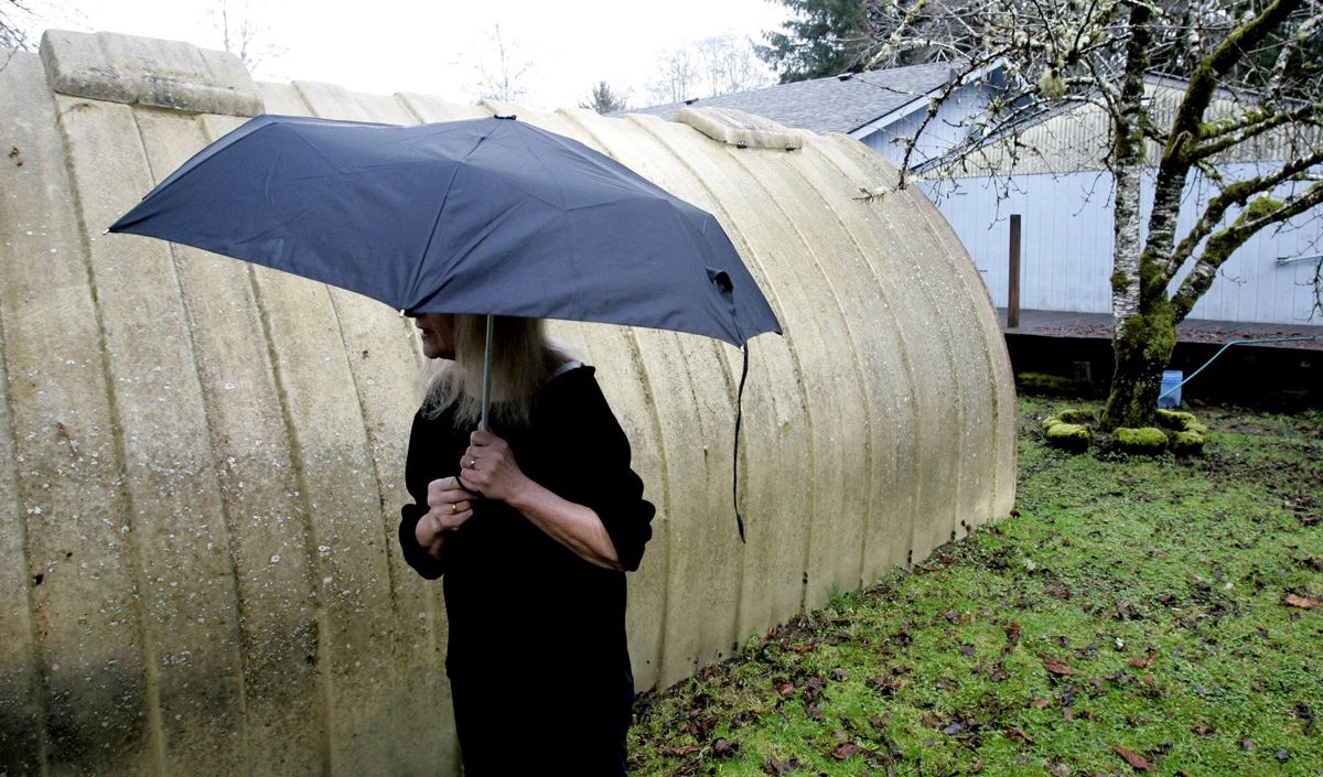 Margaret King moved to Forks, Wash., from Scotland and takes teasing from her husband, a lifelong resident, for using an umbrella. Forks is just west of the Olympic National Park boundary. Seattle Times photos (Seattle Times photos)
