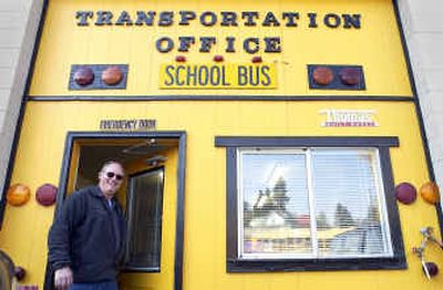 
Cliff Mooney, transportation supervisor of the St. Maries School District, stands in the doorway of the bus barn. 
 (Jesse Tinsley / The Spokesman-Review)