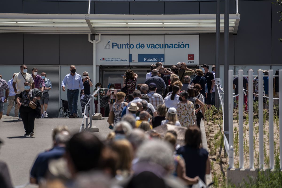 FILE - In this Tuesday, July 7, 2021 filer, hundreds of people queue to be vaccinated against COVID-19 at the Enfermera Isabel Zendal Hospital in Madrid, Spain. European nations, across the board, have made strides in their vaccination rates in recent months, with or without incentives. No country has made them mandatory, and campaigns to persuade the undecided are a patchwork.  (Olmo Calvo)