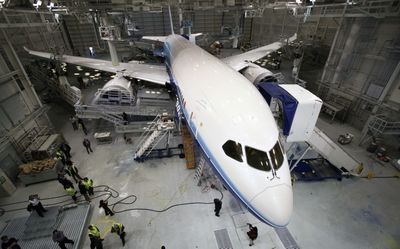 A Boeing 787 sits in a paint hangar at the company’s plant in Everett. Boeing Co. on Tuesday said it has again delayed the first test flight of its long-awaited 787 jetliner, citing a need to reinforce part of the aircraft.  (FILE Associated Press / The Spokesman-Review)