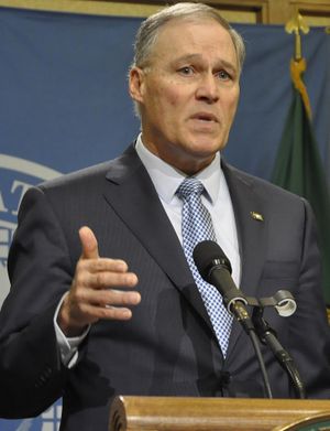 OLYMPIA – Gov. Jay Inslee tells reporters at a press conference on March 9, 2017, that he will sign the bill to extend the “levy cliff” when it arrives on his desk. (Jim Camden / The Spokesman-Review)