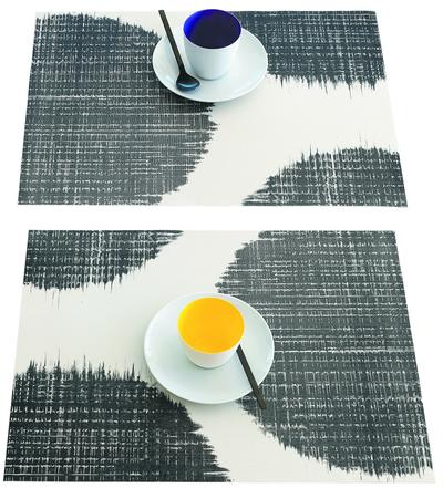 Sandy Chilewich’s new large scale abstract Brush Dot silkscreened design in black on her signature woven vinyl placemat.