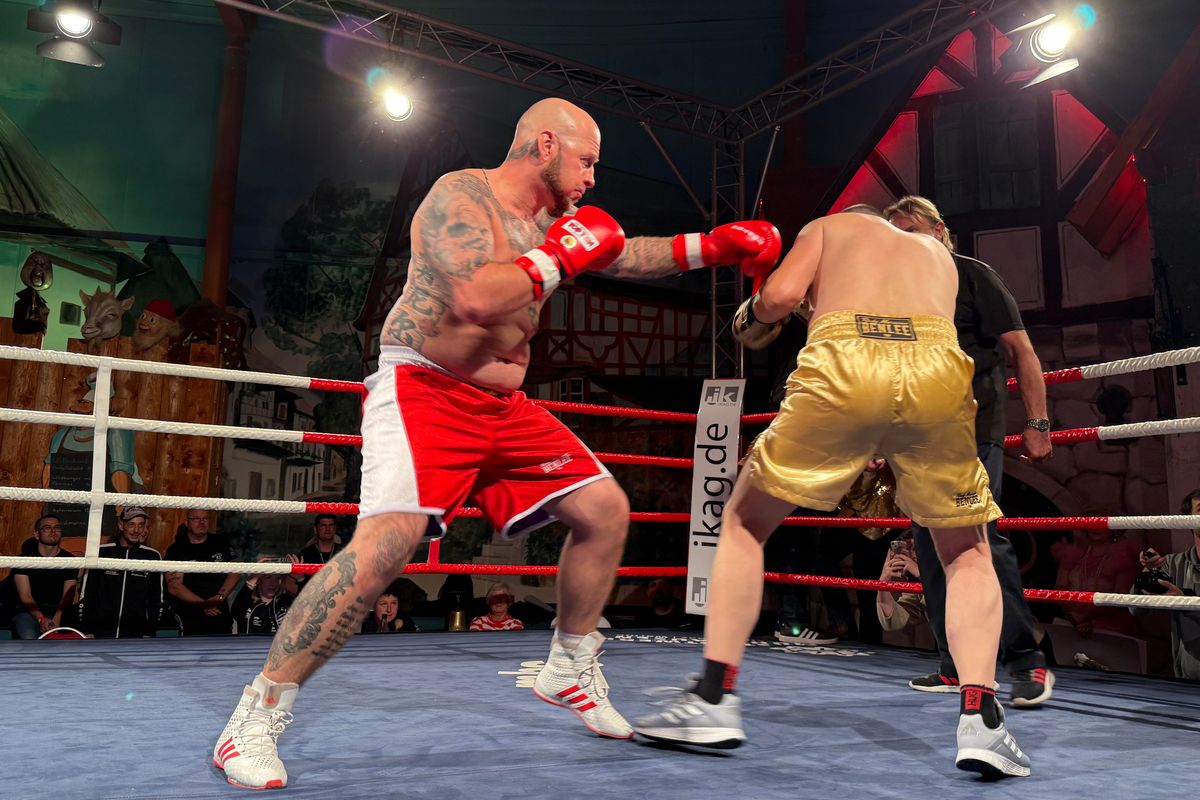 Thuringian boxer Daniel Bertz delivers a blow to Nuremberger fighter Hasan Arli at a match to determine who gets to claim the world