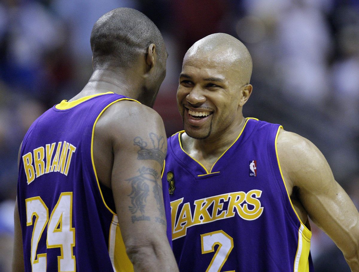 Kobe Bryant and Derek Fisher of the Lakers celebrate  victory that leaves L.A. on the brink of 15th NBA title.  (Associated Press / The Spokesman-Review)