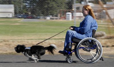 
Shelly Mitchell and her service dog, Oreo, go for a jaunt along Campbell Street in Medical Lake. Oreo is a Shih Tzu-mix and is 6 years old. 
 (Photos by Dan Pelle / The Spokesman-Review)