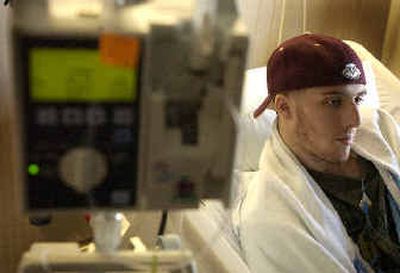 
Jason Resto, diagnosed with leukemia, rests at Kootenai Medical Center on Thursday in between chemotherapy sessions. 
 (Jesse Tinsley / The Spokesman-Review)