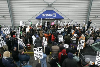 Workers and union organizers rally outside of the Republic Windows and Doors factory Saturday in Chicago. Workers laid off from their jobs at the factory have occupied the building since Friday.  (Associated Press / The Spokesman-Review)