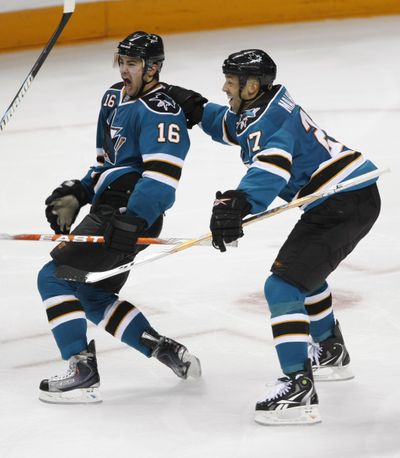 Associated Press San Jose’s Devin Setoguchi, left, is congratulated by Manny Malhotra after Setoguchi scored the winning goal in overtime. (Associated Press)