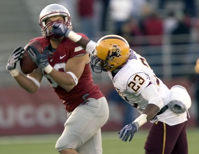 Johnny Forzani, left, beat Josh Jordan for a 99-yard TD.  (Associated Press / The Spokesman-Review)