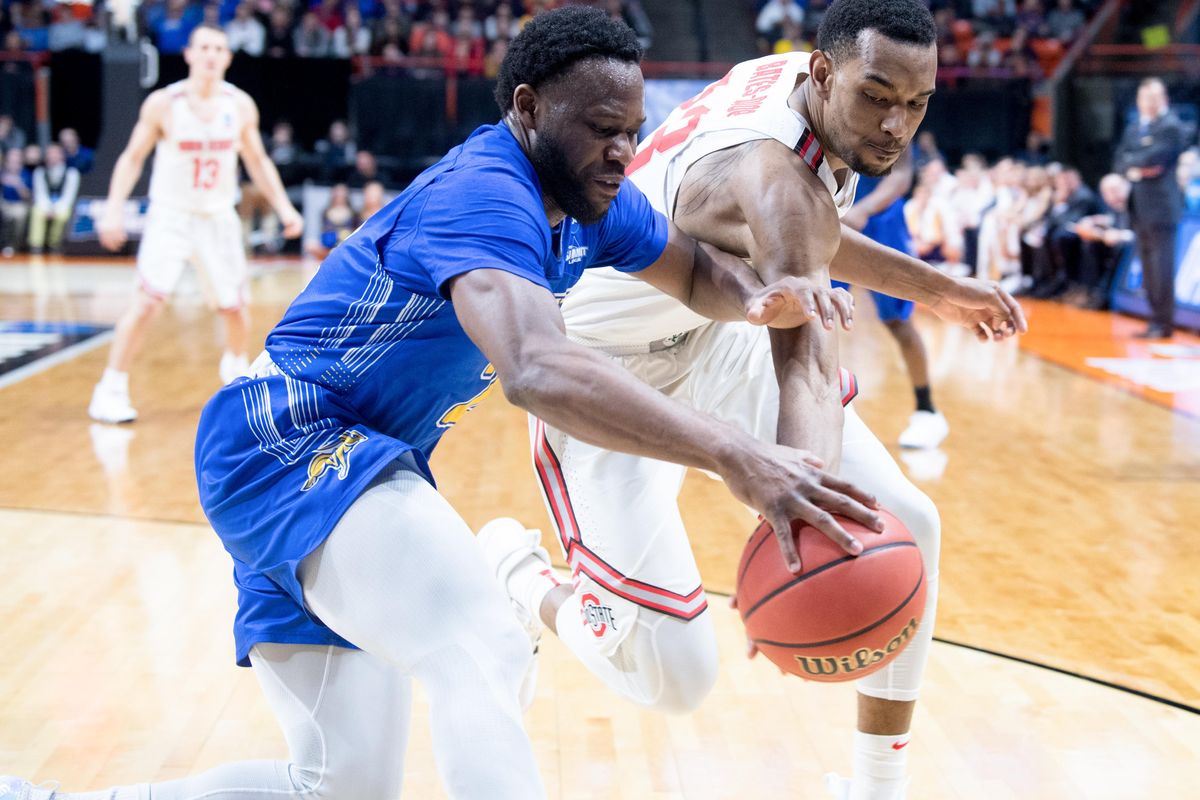 Ohio State Buckeyes forward Keita Bates-Diop (33) battles South Dakota State Jackrabbits guard Tevin King (2) for the ball during the second half of the first round of the 2018 NCAA Basketball Tournament on Thursday, March 15, 2018, at the Taco Bell Arena in Boise, Idaho. Ohio State won the game 81-73. (Tyler Tjomsland / The Spokesman-Review)