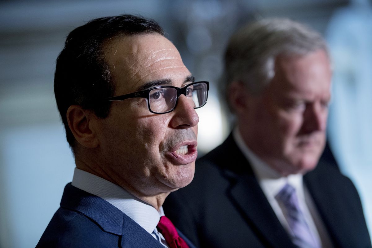 Treasury Secretary Steven Mnuchin, left, accompanied by White House Chief of Staff Mark Meadows, right, speak to reporters following a meeting with House Speaker Nancy Pelosi of Calif. and Senate Minority Leader Sen. Chuck Schumer of N.Y. as they continue to negotiate a coronavirus relief package on Capitol Hill in Washington, Friday, Aug. 7, 2020.  (Andrew Harnik)