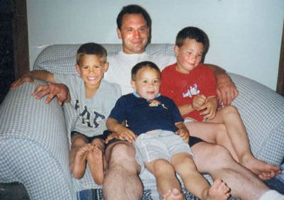 
Ric relaxes with his sons, from left, Bo, Luke and Jake.
 (The Spokesman-Review)