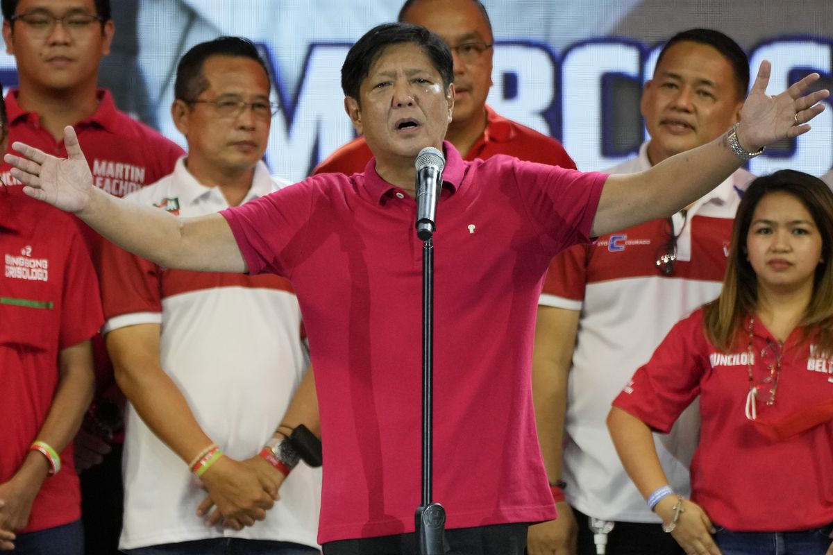 Ferdinand "Bongbong" Marcos Jr. gestures as he greets the crowd during a campaign rally in Quezon City, Philippines on April 13, 2022. Marcos Jr., son of the late dictator and his running mate Sara, who is the daughter of the outgoing President Rodrigo Duterte, are leading pre-election surveys despite his family