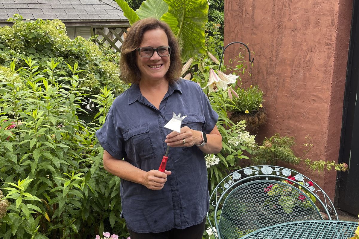 Elizabeth Licata, moderator of the Facebook group, WNY Gardeners, poses for a photograph on July 8, 2021 in Buffalo, N.Y. Moderating a Facebook gardening group is not without challenges. Facebook