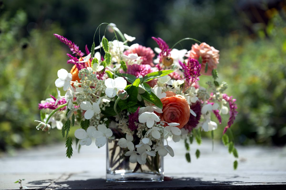 Ami Wilber, floral event decor designer at the Hillwood Museum, created this short arrangement using dahlias, hydrangeas, ranunculus, celosia, basil and sea oats. (MUST CREDIT: Washington Post photo by Marvin Joseph)  (Marvin Joseph)