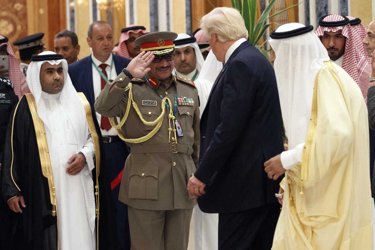 Saudi King Salman, right, and U.S. President Donald Trump are saluted as they arrive  at the Arab Islamic American Summit, at the King Abdulaziz Conference Center, Sunday, May 21, 2017, in Riyadh, Saudi Arabia. (Evan Vucci / Associated Press)