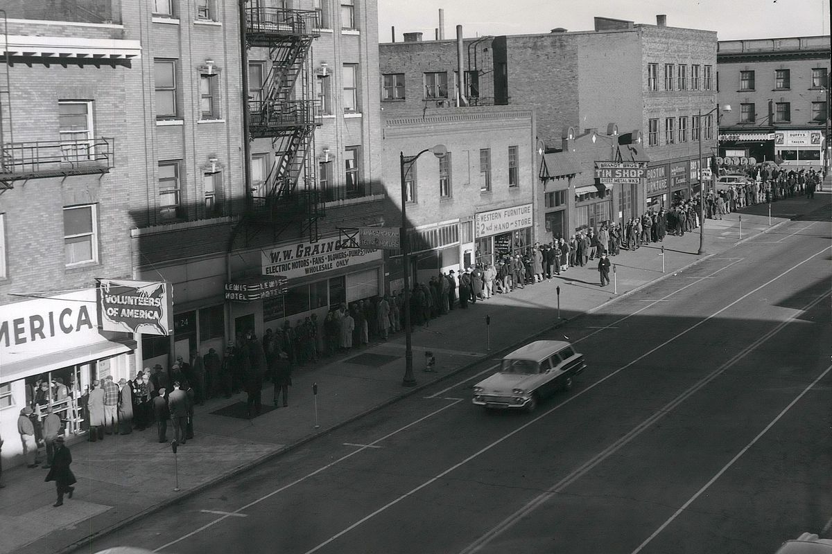 1959 – More than 200 men line up around the block on Thanksgiving morning for tickets to the Volunteers of America annual turkey dinner. The holiday dinner took place later in the day at Matson’s cafe three blocks away. For more than a century, the Volunteers of America has been alleviating suffering and social ills in the Spokane area. The VOA office was in the Imperial Block, which is now gone. The VOA helped the homeless, the unemployed, at-risk children, and the elderly alongside charities such as the Salvation Army, the YMCA and Catholic Charities. (SPOKESMAN-REVIEW PHOTO ARCHIVE / SR)