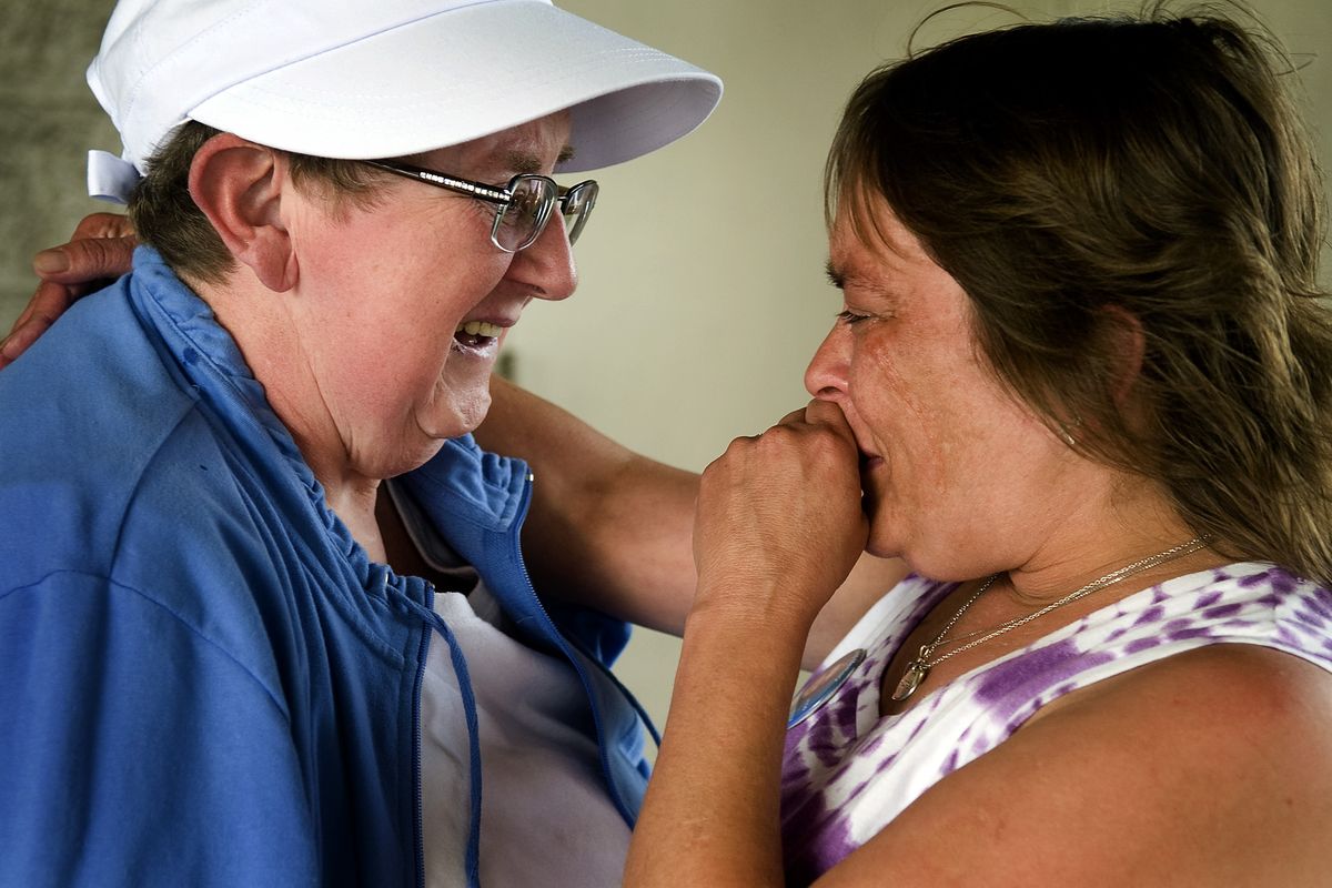 Seeing each other in person for the first time Monday in Coeur d’Alene, Cheryl Burroughs-Horne, right, whose daughter Alicia died in 2003, greets Denise Kitchen, an organ recipient who received Alicia’s lungs.  (Colin Mulvany)