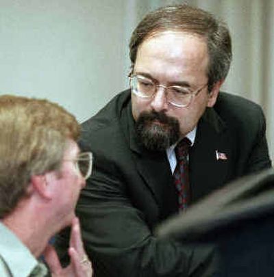 
Undersecretary of Agriculture Mark Rey, right, talks with Matt Mathes, of the U.S. Forest Service, during a news conference in 2001 in Sacramento, Calif. The local Sierra Club chapter gave its Dead Swan Award to Rey.
 (Associated Press / The Spokesman-Review)