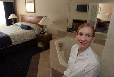 
Inn Suites vice president of condominium development Pam Barnhill displays the hotel's President Kennedy Jacuzzi Suite, a unit owned by an investor that the hotel rents out when it's available. 
 (Associated Press photos / The Spokesman-Review)