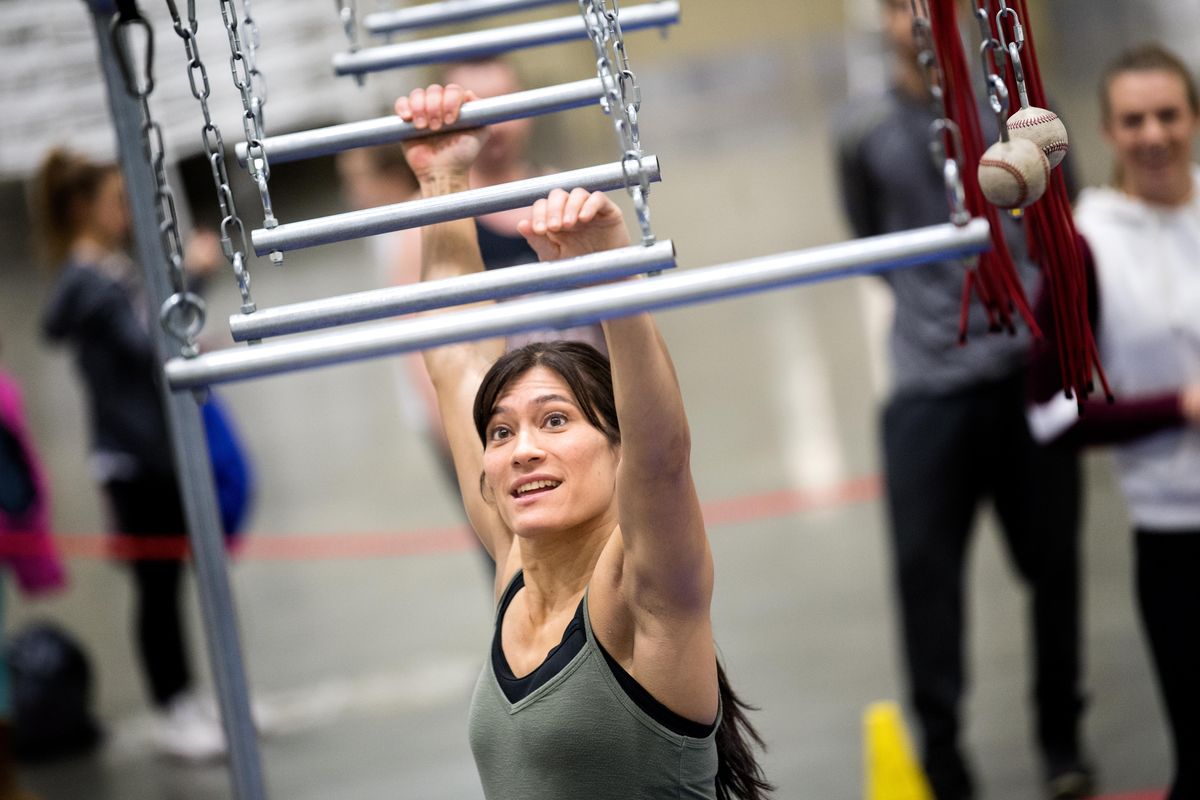 Sandy Zimmerman, an American Ninja Warrior contestant, moves through an obstacle course during a meet and greet during the Spokane Health and Fitness Expo in 2018. She appeared Monday night on the television show. (Tyler Tjomsland / The Spokesman-Review)