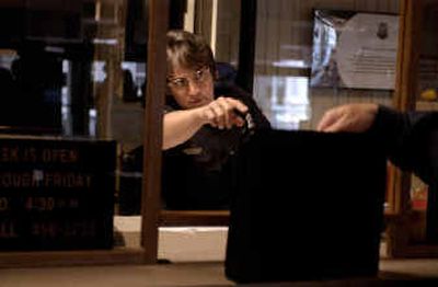 
Officer Sue Mann of the Spokane Police Department has won Employee of the Quarter. Mann works the front desk of Police Administration at the county courthouse. 
 (Kathryn Stevens / The Spokesman-Review)
