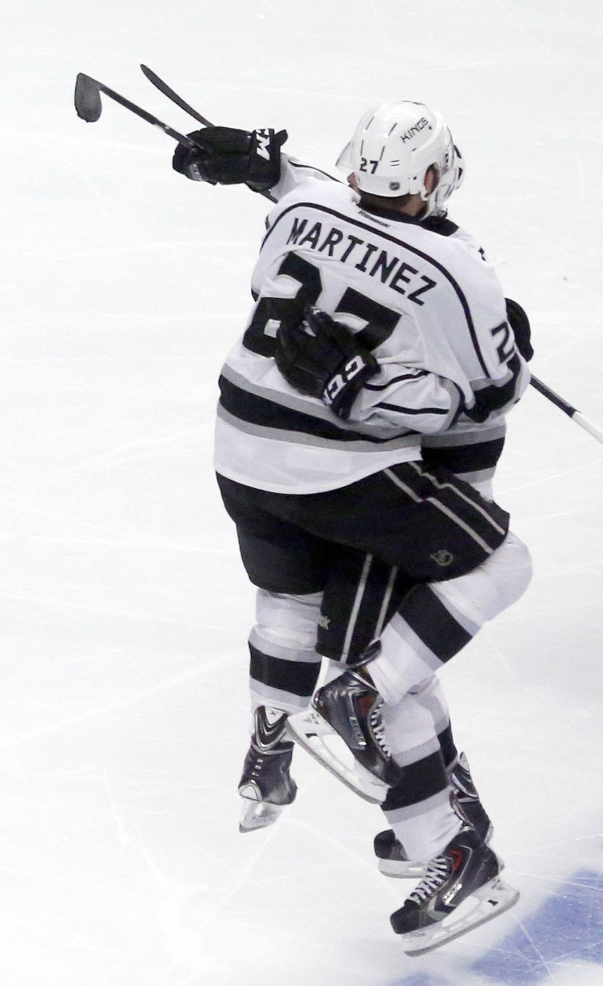 Alec Martinez jumps into teammate’s arms after scoring OT goal to beat Chicago 5-4. (Associated Press)