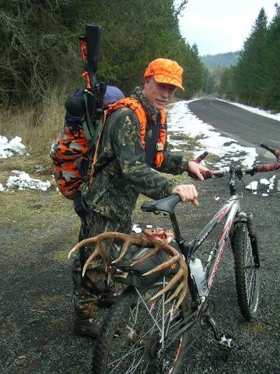 North Idaho hunter Pat Behm used a mountain bike to access a deer hunting area up an Idaho Panhandle National Forest road that's closed to motorized vehicles in mid-November.  He and his hunting partner boned out this buck, carried the meat in their packs and pedaled out to the main road. (John Karpenko)