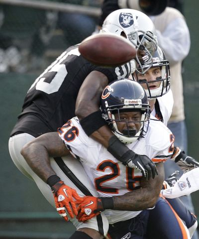 Chicago Bears cornerback Tim Jennings breaks up a pass intended for Oakland Raiders wide receiver Darrius Heyward-Bey. Oakland went on to win 25-20. (Associated Press)