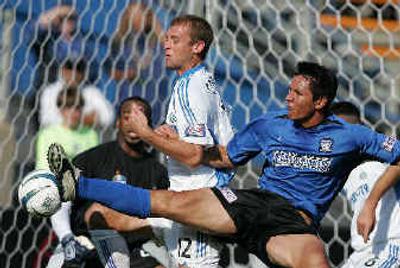 
San Jose's Brian Ching attempts to score against Kansas City during the Western Conference playoffs on Oct. 24. 
 (Associated Press / The Spokesman-Review)