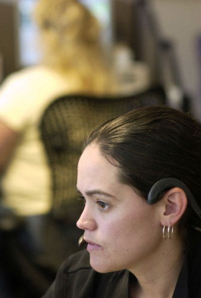 
Dispatcher Dory Shippey takes calls at the Willamette Valley Communications Center in Salem. 
 (Associated Press / The Spokesman-Review)